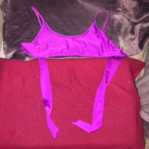 A bright purple bikini top